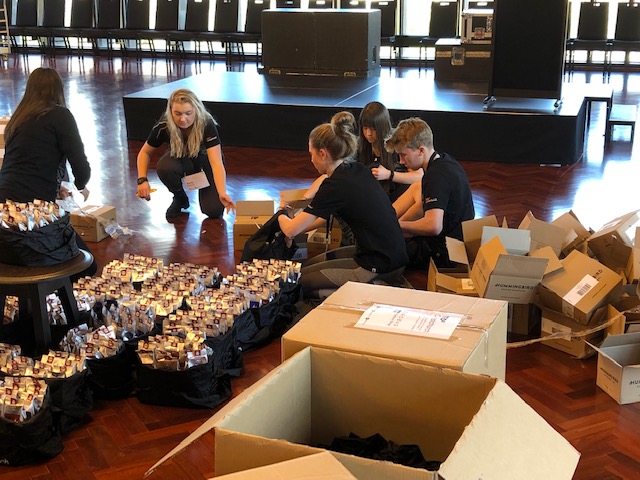 Volunteers setting up a conference