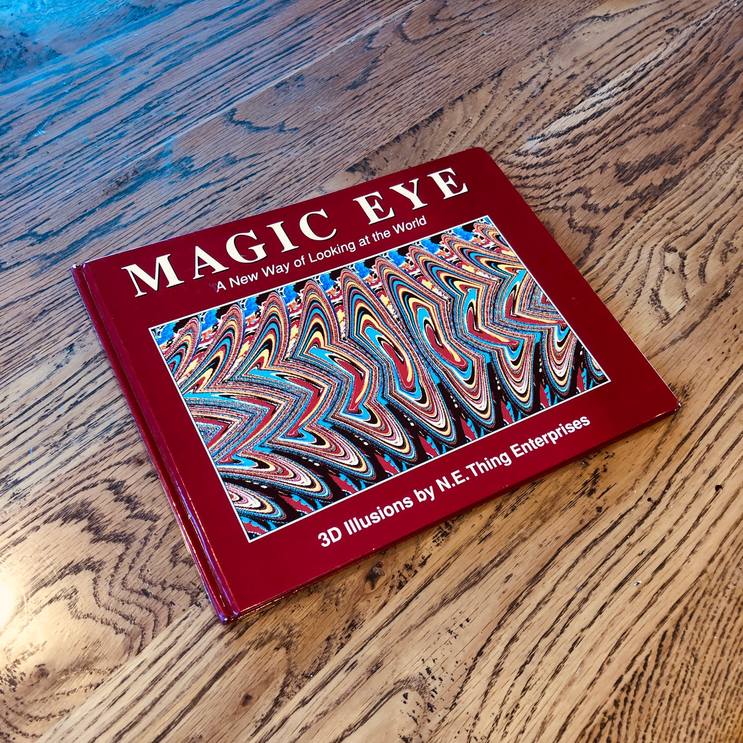 A Magic Eye book sitting on a table.,